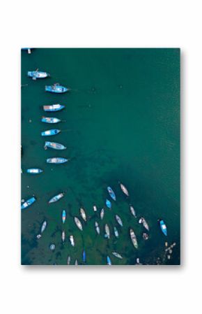 aerial view of fishing boats in blue water, serene harbor and peaceful marine tranquility, drone perspective of anchored vessels on turquoise sea, calm bay and nautical harmony