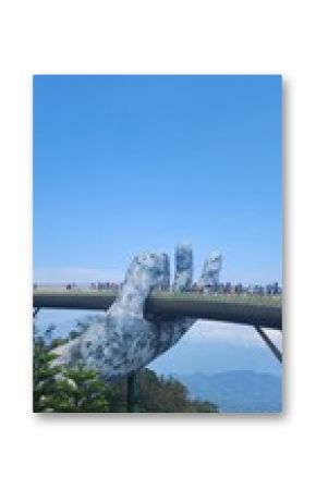 Golden Bridge held by giant stone hands, Ba Na Hills, Da Nang, Vietnam”