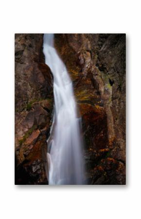 Glen Ellis Falls, a serene 64-foot plunge waterfall on the Ellis River with rugged cliffs in White Mountain National Forest