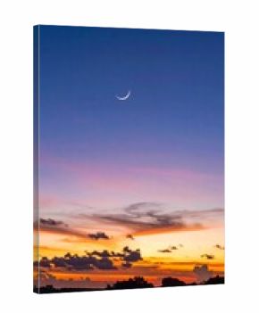 Sunset sky with crescent moon