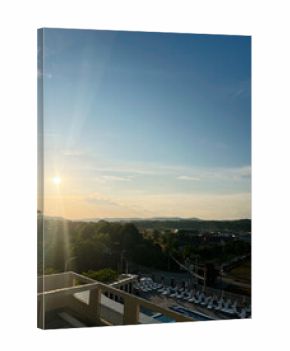 Serene sunrise over a suburban landscape with vibrant natural and urban elements