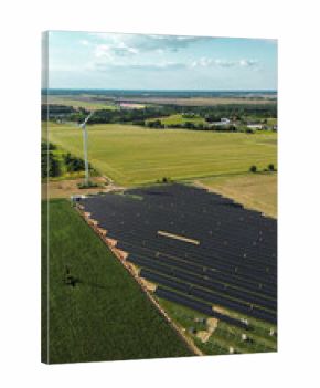 Rural farmland with solar panels and wind turbine