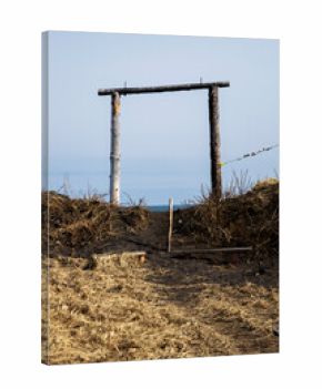 wooden supports of swing on beach of Avacha bay