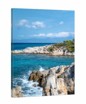 Turquoise beach with rocks . Portokali beach, Sithonia,  Halkidiki, Greece . Sea background 