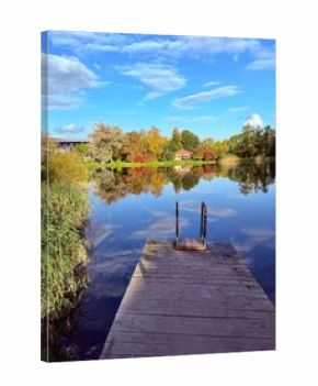 autumn trees reflection on the blue lake surface, autumn lake in the park