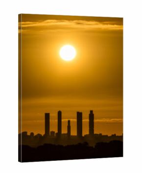 Sunrise views of the Madrid skyline through the morning mist