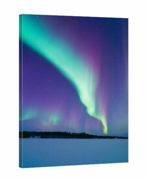 Aurora Borealis in Scandinavia. Northern lights over frozen lake and forest. Starry sky. Glow on the sky. Winter landscape on the north. Picturesque view. Photo for background, wallpaper, postcards.