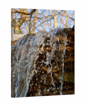 Small waterfall of melting snow at Kickapoo State Park in Illinois