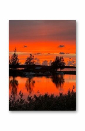 Pink and red beautiful sunset over a lake in finlands archipelago. Landscape view over the ocean. 