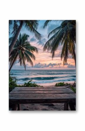 A wooden table sits on the edge of a sandy beach, perfect for outdoor gatherings or a unique picnic spot