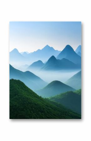 Majestic mountain landscape with layers of peaks and misty valleys in early morning light