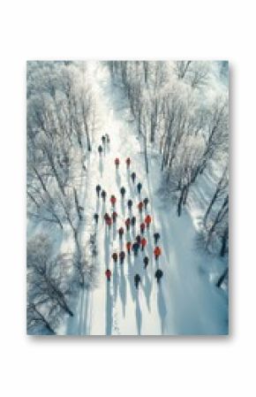 Aerial View of People in Red and Black Amidst Snow-Covered Forest