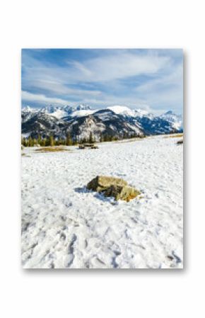 Mountain glade in winter scenery.    Picnic tables with banches   inn white winter  landscape of  Hight Tatra Mountains. Hiking trawl to Rusinowa glade, Tatra Mountain , Poland 