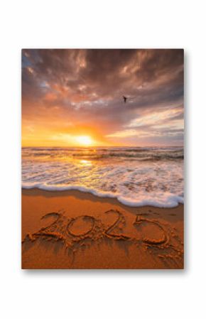 Happy New Year 2025 concept, lettering on the beach. Written text on the sea beach at sunrise vertical