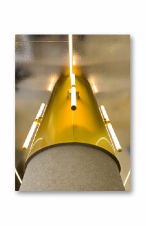 A yellow light fixture with a white base and a yellow top