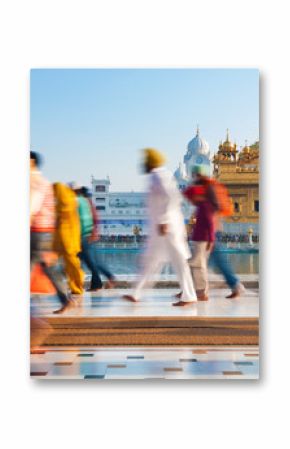 Group of Sikh pilgrims walking by the Golden Temple