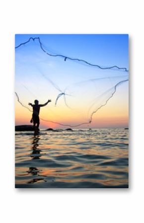 throwing fishing net during sunrise, Thailand