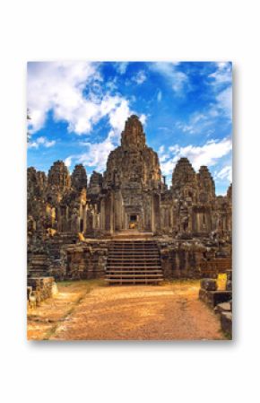 Ancient stone faces at sunset of Bayon temple, Angkor Wat, Siam