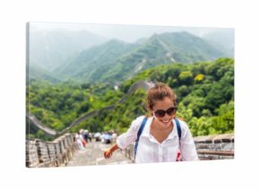 china travel at Great Wall. Tourist in Asia walking on famous Chinese tourist destination and attraction in Badaling north of Beijing. Woman traveler hiking great wall enjoying her summer vacation.