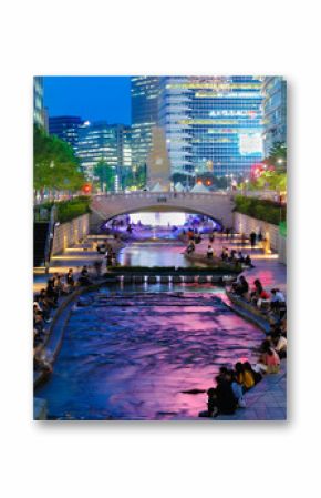 Colorful city lights of Cheonggyecheon Stream Park with Crowd at night in Seoul City, South Korea. 