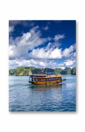 cruising among beautiful limestone rocks and secluded beaches in Ha Long bay, UNESCO world heritage site, Vietnam