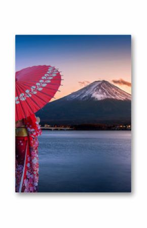 Asian woman wearing japanese traditional kimono at Fuji mountain. Sunset at Kawaguchiko lake in Japan.
