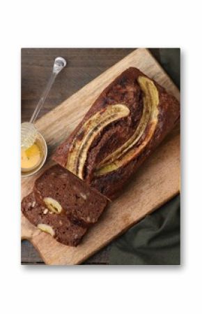 Delicious banana bread served on wooden table, flat lay