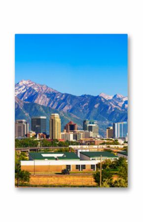 Skyline of Salt Lake City downtown in Utah with Wasatch Range Mountains in the background.