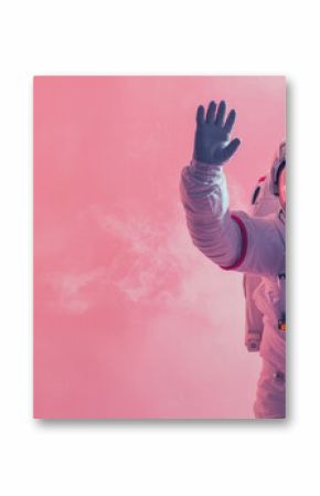 An astronaut waves capturing a human connection in a solitary smoky, pink environment, suggesting camaraderie