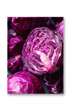 Fresh red cabbage heads are piled together, showing a vibrant purple color and interesting texture
