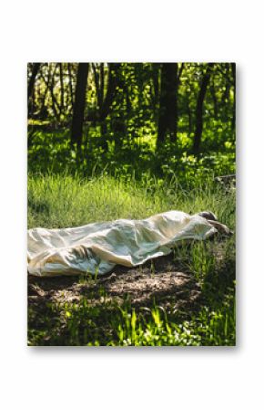 A caucasian man's dead body was found in the park. Murder in the woods. Murdered citizen. Crime scene