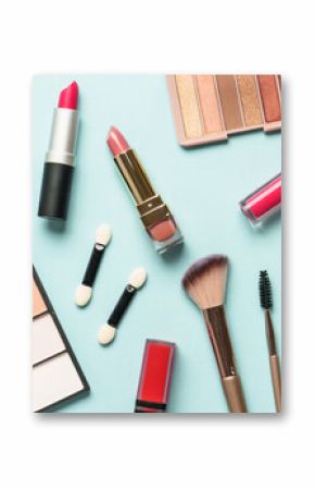 Beauty products on blue background. Cosmetic palette, brushes, cream and lipsticks. Long banner format.