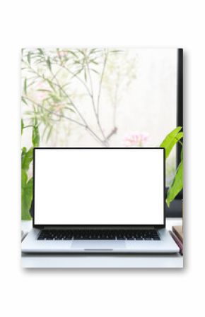 Laptop and phone with coffee and plant, cozy indoor workspace