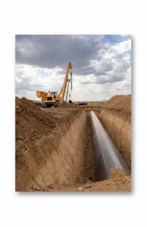 Large Pipeline Construction. Heavy Machinery Installing Underground Gas or Oil Pipeline. Infrastructure Development and Energy Industry Concept.  Industrial Infrastructure Project