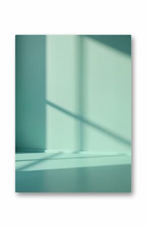 Minimalist teal room interior with window, shadows from sunlight. Modern architecture with copy space. Empty room with minimalist design. Calm, tranquil space for product placement, design