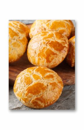 Chinese pineapple buns or bo lo bao they don’t actually contain any pineapple, but get their names from their golden crusted tops closeup on the table. Horizontal