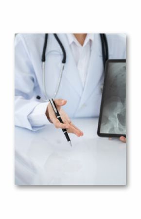 Orthopedist doctor explain spine lumber vertebrae x-ray image on digital tablet to the patient for diagnose Herniated Disc disease and Spondylosis, Spondylolisthesis.