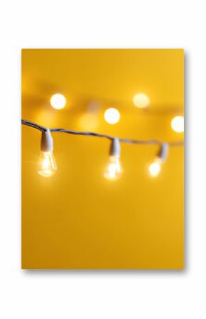 Warm, glowing string lights against a vibrant yellow background create a cozy and inviting atmosphere for any occasion.