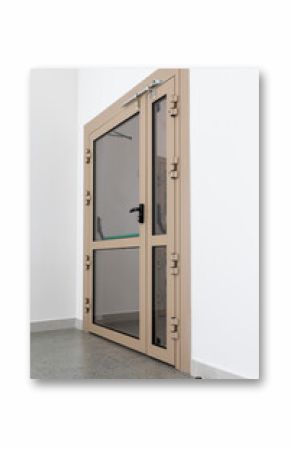 Modern fire door is reliable, functional entrance to public or administrative building. Beige fire door with transparent glass sections and metal frame for hospitals, schools or office buildings