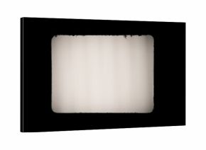 Old, blank projector film frame isolated on black background with copy space