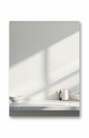 White kitchen interior with empty table, sunlight casting shadows on white wall, perfect for photography compositions.