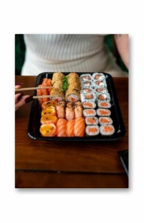 Sushi platter with assorted rolls and sashimi.