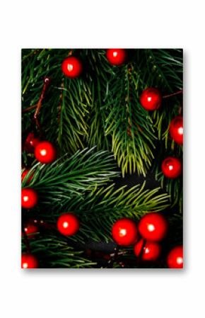 Christmas background with fir tree and red berries decoration. New year background frame for holiday wish list post.