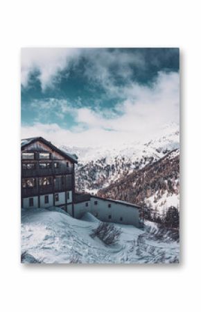 Snowy Italy Trentino Alps and wooden cottage on top. Folgarida Marilleva region