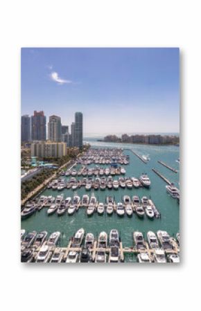 Luxury yacht cruising on Miamis coastline. Aerial view of yachts docked in Miami marina. Miami skyline yachts. Miami Beach with yacht in bay. Summer vacation in Miami. Yachts in South Pointe Marina.
