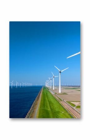 Vast offshore windmill park in the Netherlands showcasing numerous wind turbines along the coastline. The clear blue sky complements the sustainable energy landscape, highlighting renewable resources.