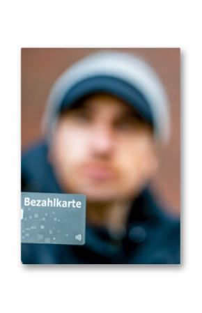 A refugee with a payment card (Bezahlkarte) in Germany. Symbol for the new payment card for refugees in Germany.