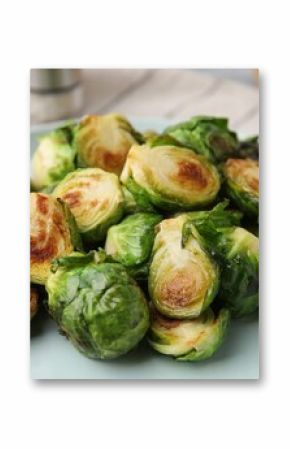 Delicious roasted Brussels sprouts on table, closeup