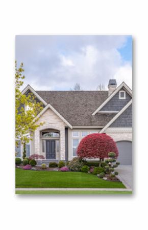 Two story stucco luxury house with nice spring blossom landscape in Vancouver, Canada, North America. Day time on April 2025.