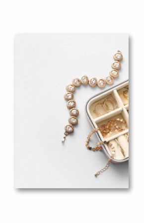 Organizer with beautiful golden jewelry on grey background